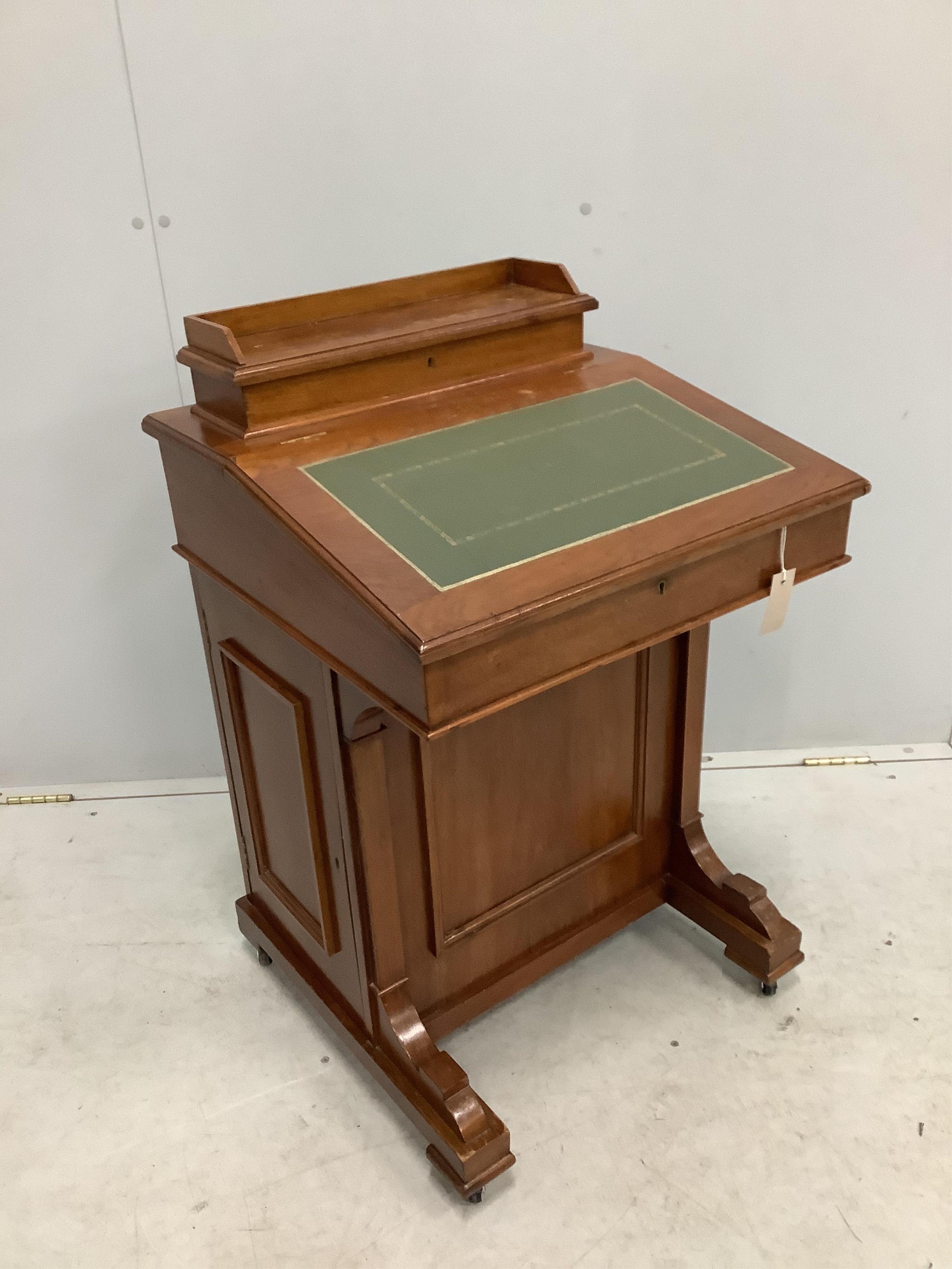 A late Victorian walnut Davenport, width 55cm, depth 53cm, height 87cm. Condition - fair